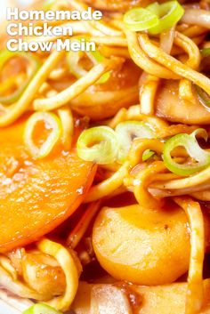 a close up of food on a plate with onions and carrots in the background