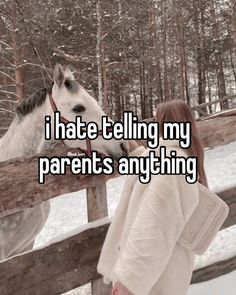 a woman standing in front of a fence next to a horse with the caption i hate telling my parents anything