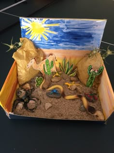 a desert scene made out of sand and rocks