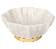 a white bowl with gold rim on a white background