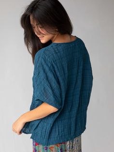 The soft, smocked texture! The relaxed, flattering fit! So EASY to dress up or down! Flowy Short Sleeve Tops For Loungewear, Bohemian V-neck Tops For Layering, Bohemian Crew Neck Top For Layering, Rayon V-neck Blouse For Loungewear, V-neck Rayon Blouse For Loungewear, Bohemian Relaxed Fit Top For Layering, Flowy Cotton Tops For Loungewear, Versatile Cotton V-neck Tops, Casual Tops With Crinkle Texture For Layering