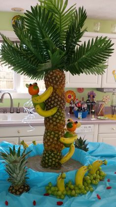 a pineapple and banana tree made out of fruit