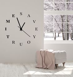 a white room with a large clock on the wall