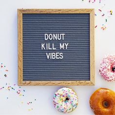 donuts with sprinkles surrounding a sign that says, donut kill my vibes