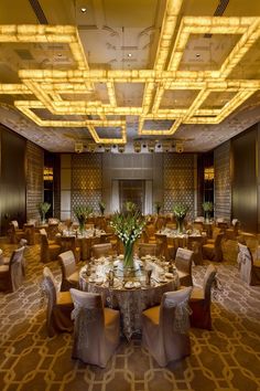 a banquet room with round tables and chairs