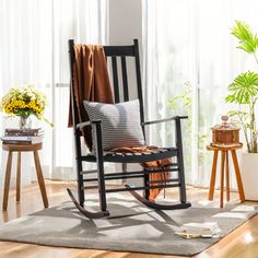 a rocking chair in the corner of a room