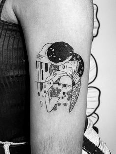 black and white photo of a woman holding a man's head with an abstract tattoo design on the arm