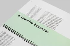 an open book with the words creative industries printed on it