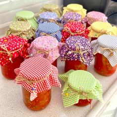 several jars filled with jam sitting on top of a counter