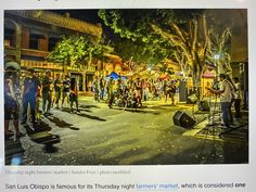 a group of people that are standing in the street