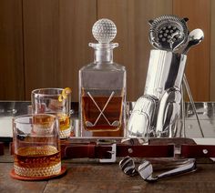 an assortment of liquor bottles and utensils on a table