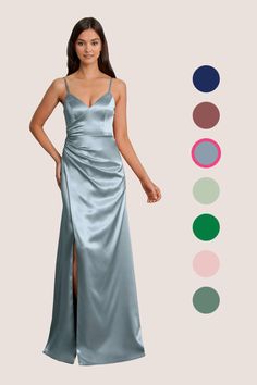 a woman in a long blue dress standing next to an assortment of color swatches