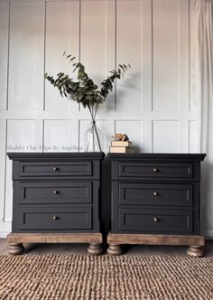 two black dressers side by side with plants on top