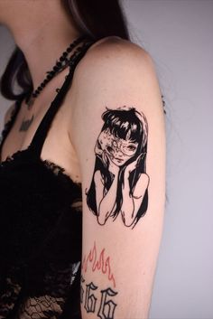 a woman with a tattoo on her arm