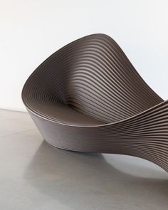 an unusual chair is sitting on the floor