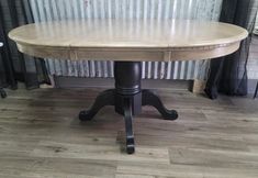 a wooden table sitting on top of a hard wood floor