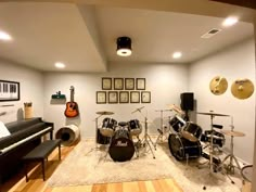 a living room filled with furniture and musical instruments