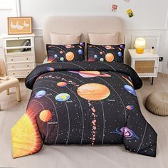 a bed room with a neatly made bed and space themed comforter set on it