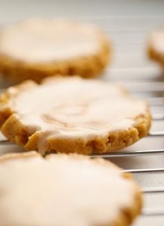 cookies with icing sitting on a cooling rack