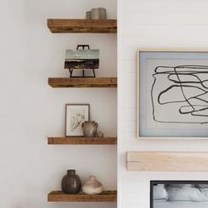 the shelves in this living room are made out of wood