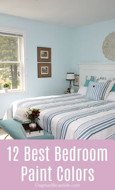 a bedroom with blue walls and white furniture