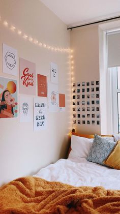 a bedroom with posters on the wall