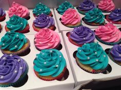 there are many cupcakes with different colored frosting