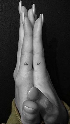 two hands with the words pray written on them