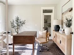 a living room filled with furniture and a wooden table