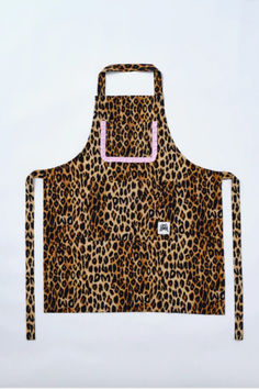 a leopard print apron with pink straps