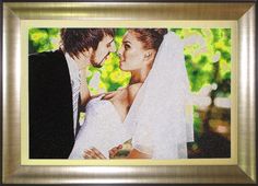 a painting of a bride and groom kissing each other