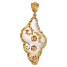 Shell Shape carved rock crystal Pendant necklace, handcrafted in 22Kt yellow gold, featuring round Tourmalines. This breathtaking jewelry piece is braided according to the ancestral techniques of granulation and filigree. The delicate and intricate wire ornamentation of Filigree that is soldered onto the pendant and the minute gold beads of granultion around the gemstones add imperial aura in this elegant pendant. This One-Of-A-Kind Pendant belongs to Odyssea Collection: A collection inspired by Luxury Carved Gold Necklace, Exquisite Carved Yellow Gold Jewelry, Luxury Carved Yellow Gold Necklaces, Gold Elegant Carved Jewelry, Elegant Carved Gold Jewelry, Luxury Carved Gold Jewelry, Elegant Gold Carved Jewelry, Exquisite Carved Gold Jewelry, Luxury Carved Pendant Jewelry