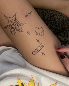 a woman's leg with tattoos on it and the word love written in cursive writing