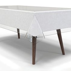 a white table with wooden legs and a clear cover