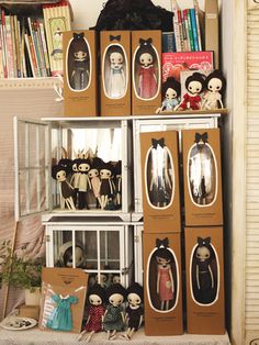 there are many dolls on the shelves in this room