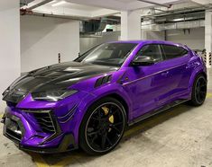 a purple sports car parked in a garage