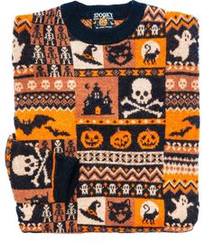 an orange and black sweater with skulls, bones, and other items on the front