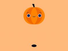 an orange pumpkin with eyes and nose drawn on it's side, in front of a brown background