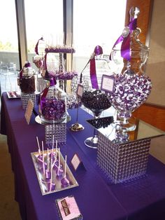 purple and silver candy bar with candies on the table