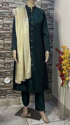 This stylish sherwani suit is made  of high quality silk fabric. Its a two piece dress. This is stitch in front open sherwani style kurta emblished with silver buttons having sequin work Custom to order. All sizes available Stitching  For stitched dresses you can chose from size chart or can message us for customization.our team will send you size chart for customization. Feel free to convo for any details to help you in your selection because customize dresses cannot be return or exchange. Note: color may slightly vary because of different screen resolutions. We have an expert customization team .if you have any problem regarding taking measurements please convo for our help. All the measurements are rechecked before dispatch. Long Sleeve Cotton Silk Kurta With Sheer Dupatta, Designer Cotton Silk Kurta With Traditional Drape, Designer Cotton Silk Sherwani With Traditional Drape, Traditional Green Silk Sherwani, Designer Green Silk Sherwani, Straight Kurta With Sheer Dupatta In Art Silk, Art Silk Kurta With Sheer Dupatta, Cotton Silk Churidar With Sheer Dupatta, Long Sleeve Cotton Silk Churidar With Sheer Dupatta