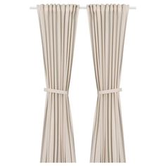 two white curtains with ties on them