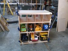 a shelf filled with lots of toys in a garage