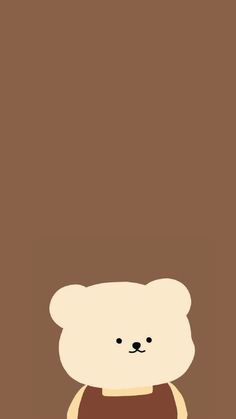 a teddy bear with a brown shirt on is standing in front of a wall and looking at the camera