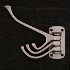 an image of a metal hook on a wooden surface