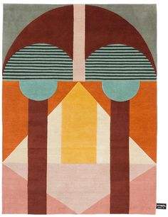 a colorful rug with trees and shapes on it