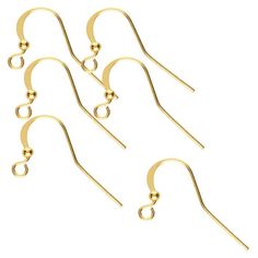 five pairs of gold plated earrings with dangling hooks and balls on each earring