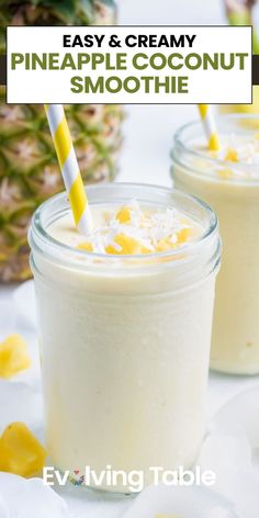 two glasses filled with pineapple coconut smoothie on top of a white tablecloth