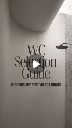 a bathroom with the words we selection guide painted on the wall and shower head in the corner