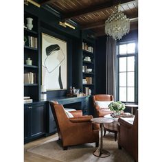 a living room filled with furniture and a chandelier