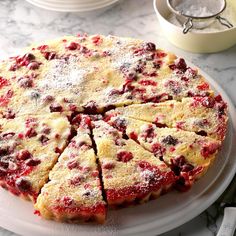 there is a cake on the table with many slices cut out and ready to be eaten